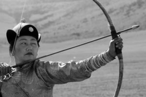 ULAN BATOR, MONGOLIA - JUNE 18: A Mongolian woman shows her archery skills on June 18, 2006 in Ulan Bator, Mongolia. Mongolia celebrates its 800th birthday this year. (Photo by Koichi Kamoshida/Getty Images)